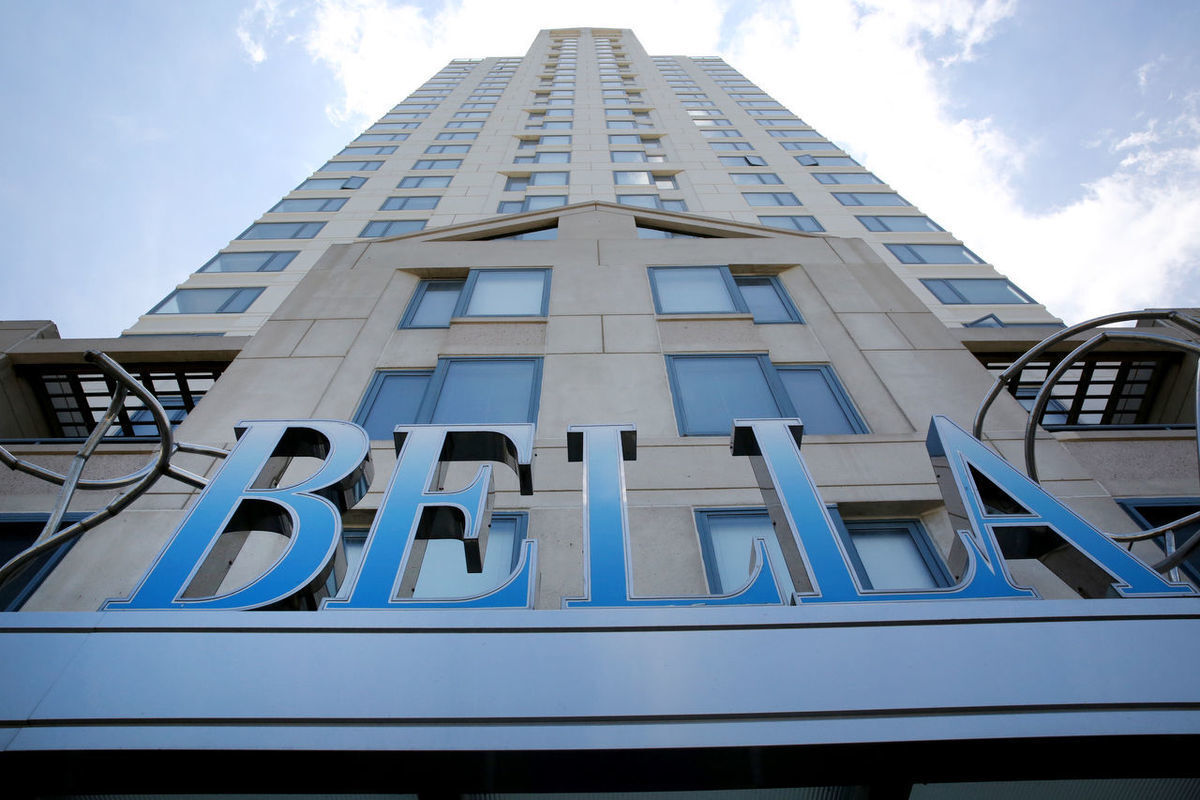 Bella Sign Looking Up Building.jpg